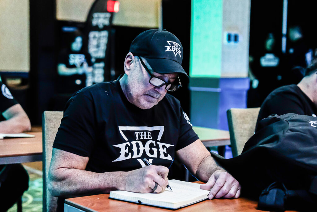 businessman taking notes at edge bootcamp event